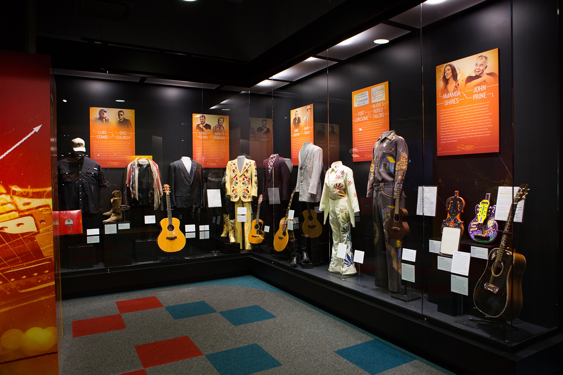 Country Music Hall of Fame view of costumes & guitars