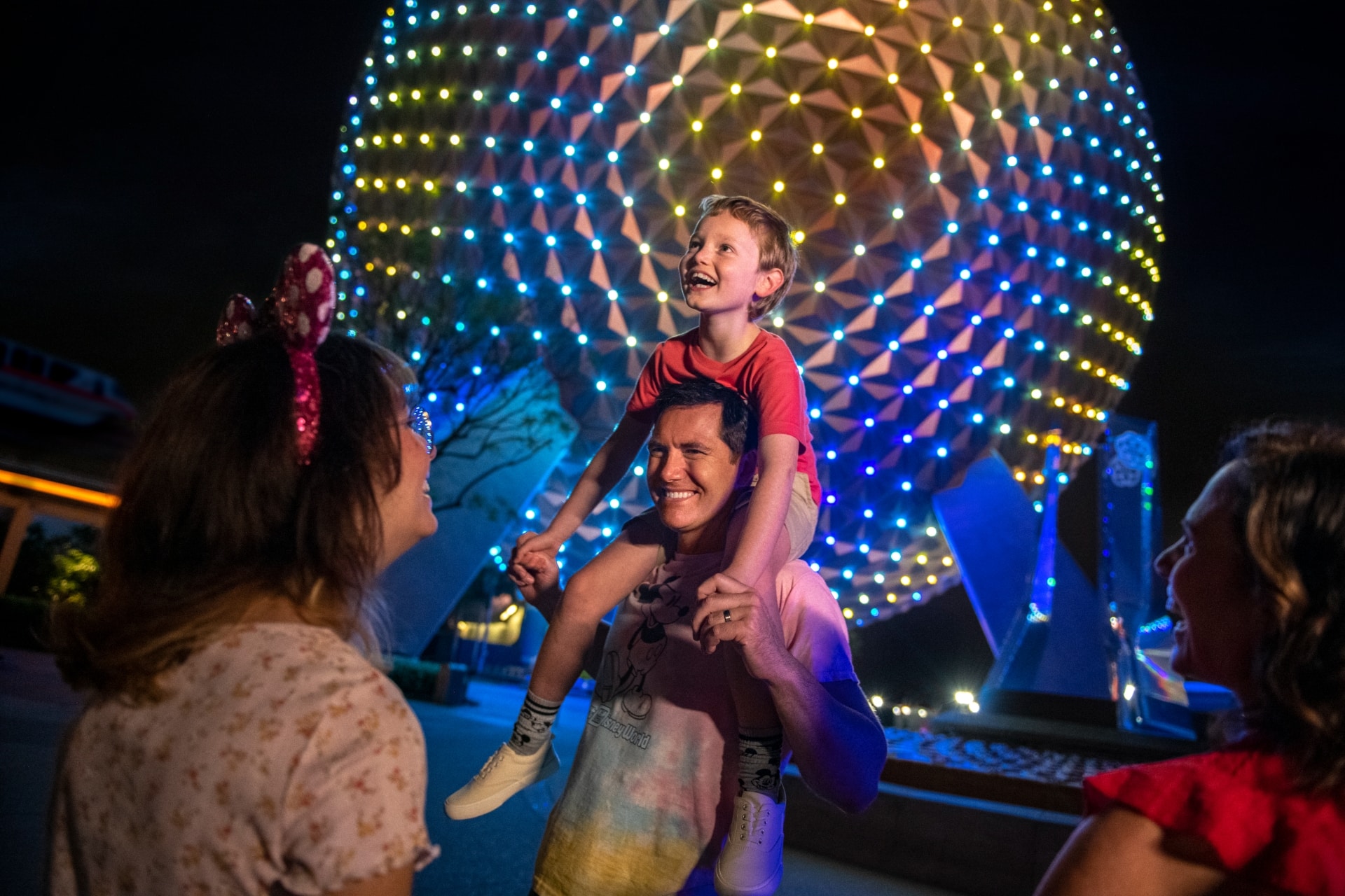 Family in front of the EPCOT globe, Florida