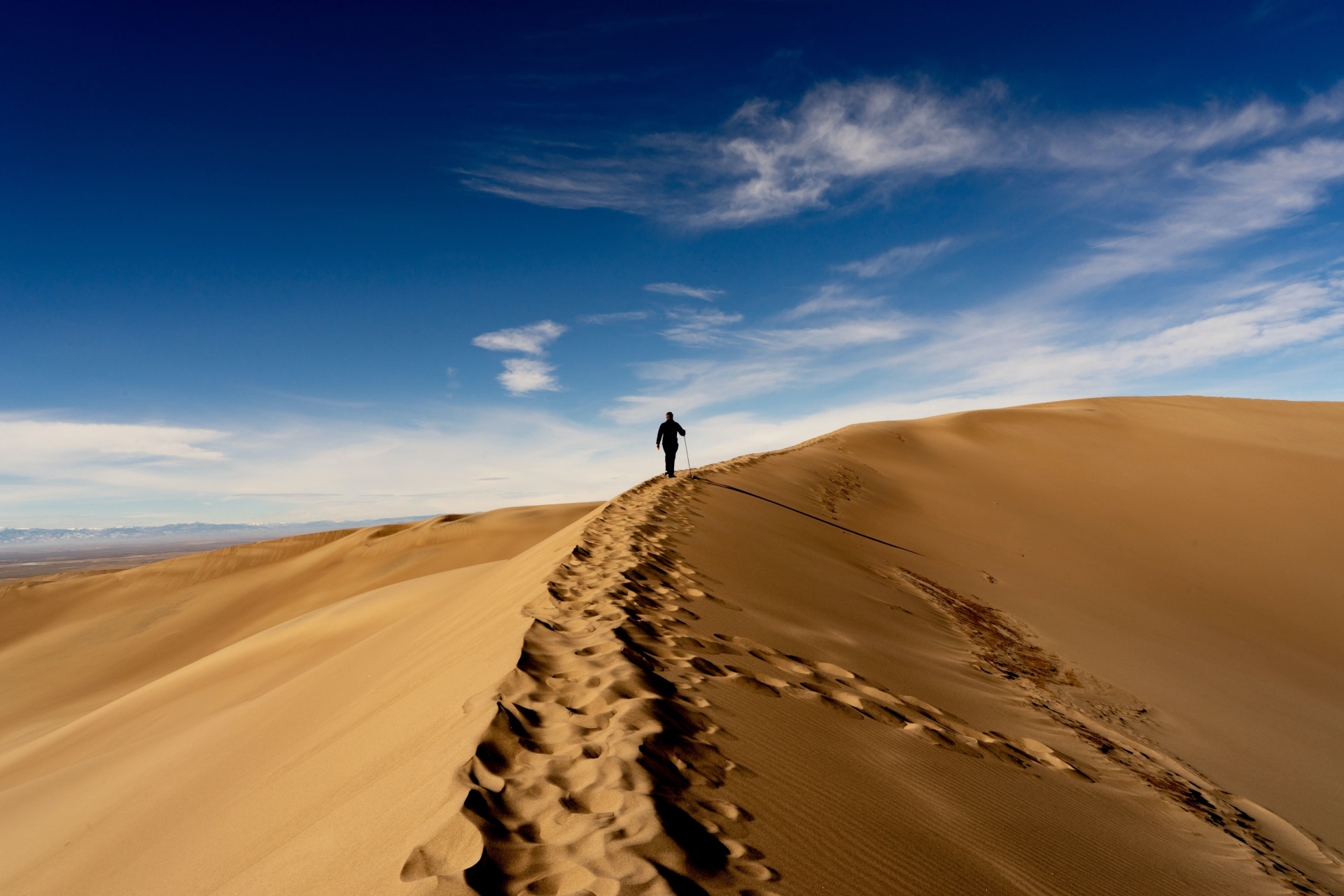 Great Sand Dunes National Park-Colorado with man walking on top of the Dunes