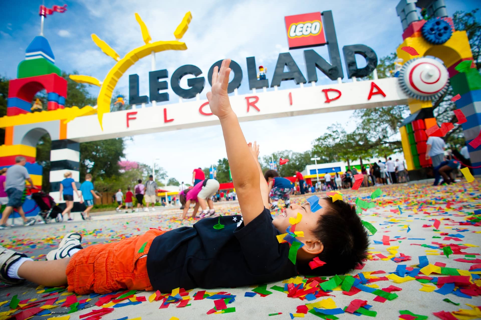 Child lying down outside the entrance to LEGOLAND Florida