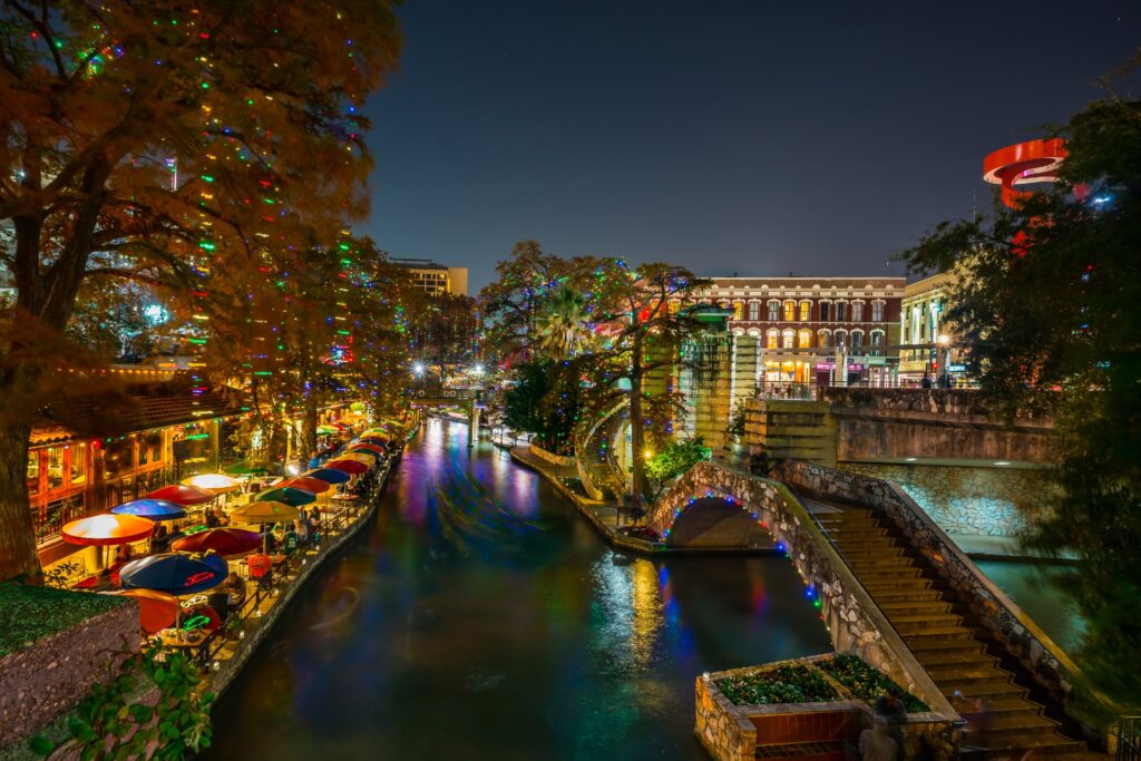 San Antonio River Walk night view of restaurants & bridge