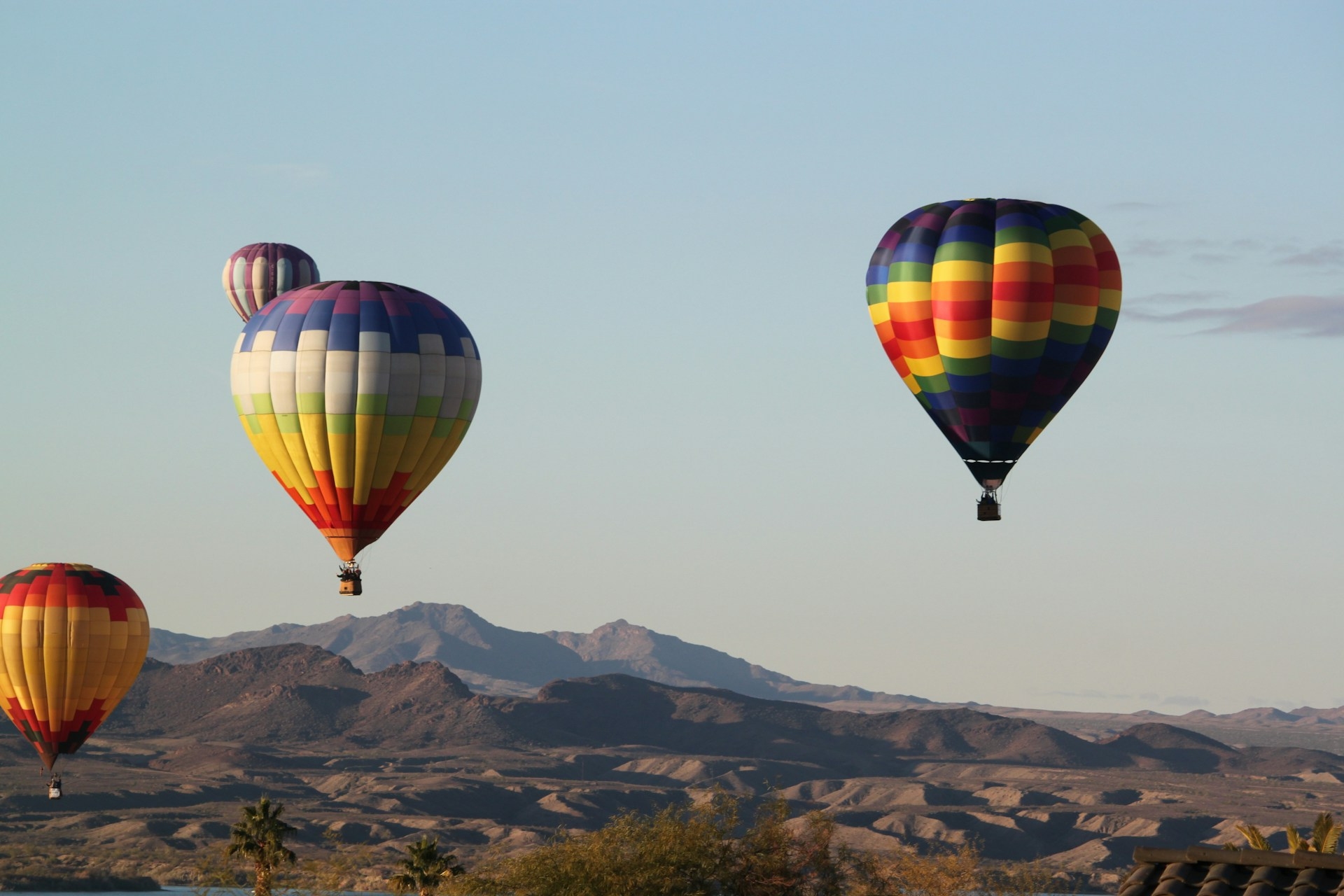 Hot Air Ballooning in Arizona on a clear day overlooking the mountains