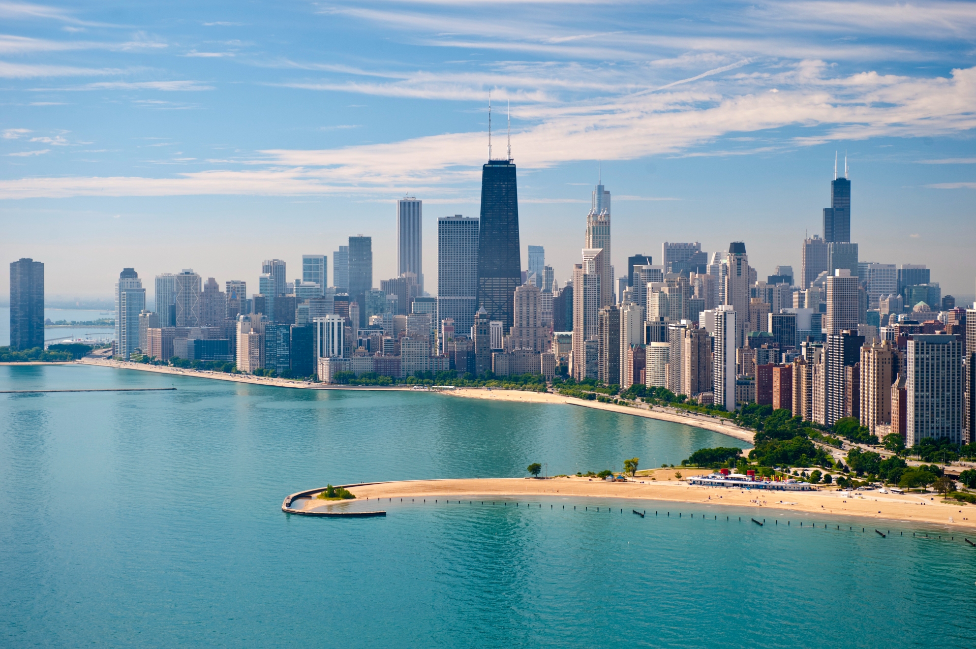 Illinois' Chicago skyline with Lake Michigan in the foreground on a clear day.