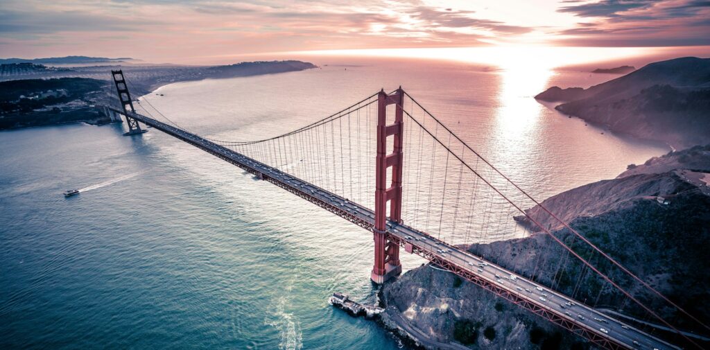 San Francisco Bridge stunning ariel shot of Golden Gate Bridge at sunset