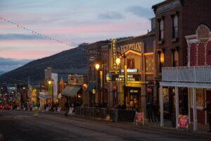 Twilight descends on a festive street adorned with lights, where a crowd gathers for the sundance film festival outside the iconic egyptian theatre.