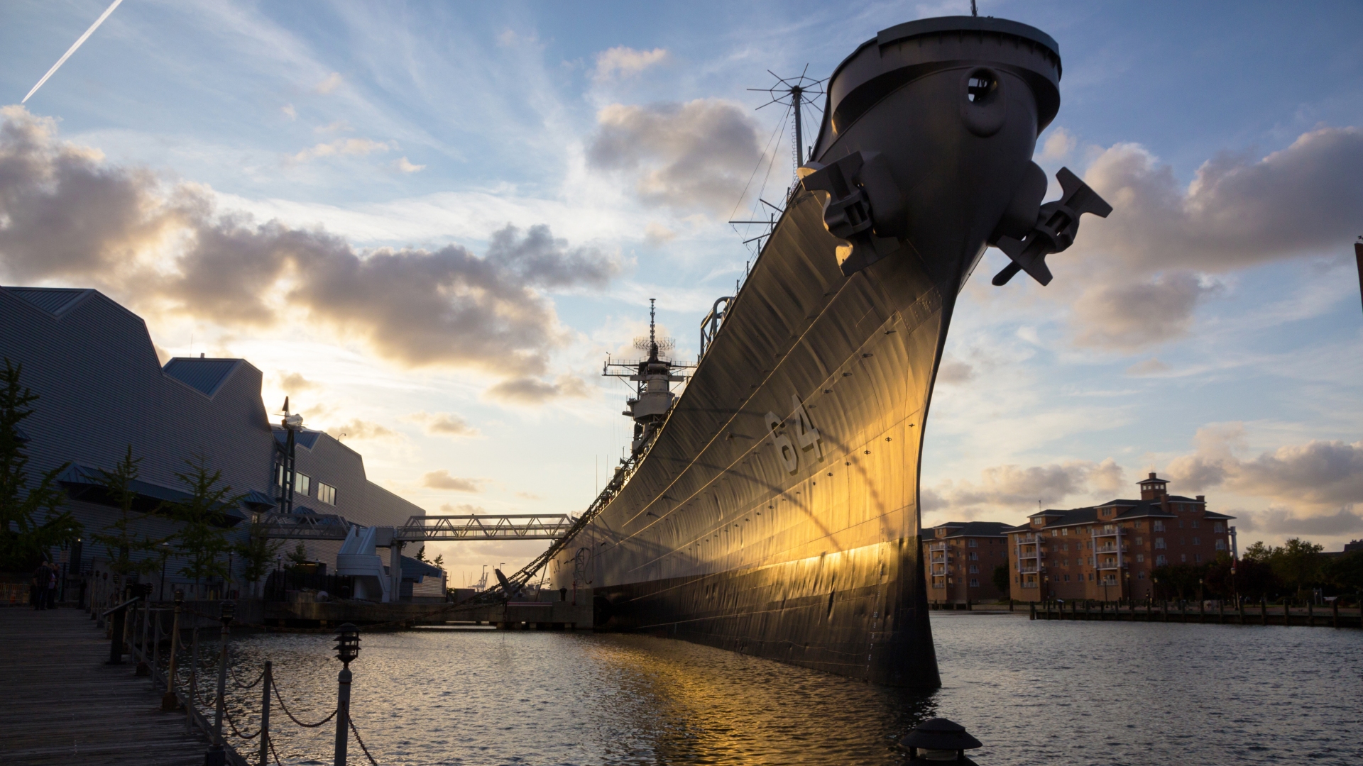 Battleship Wisconsin at sunset with the front of the ship standing high