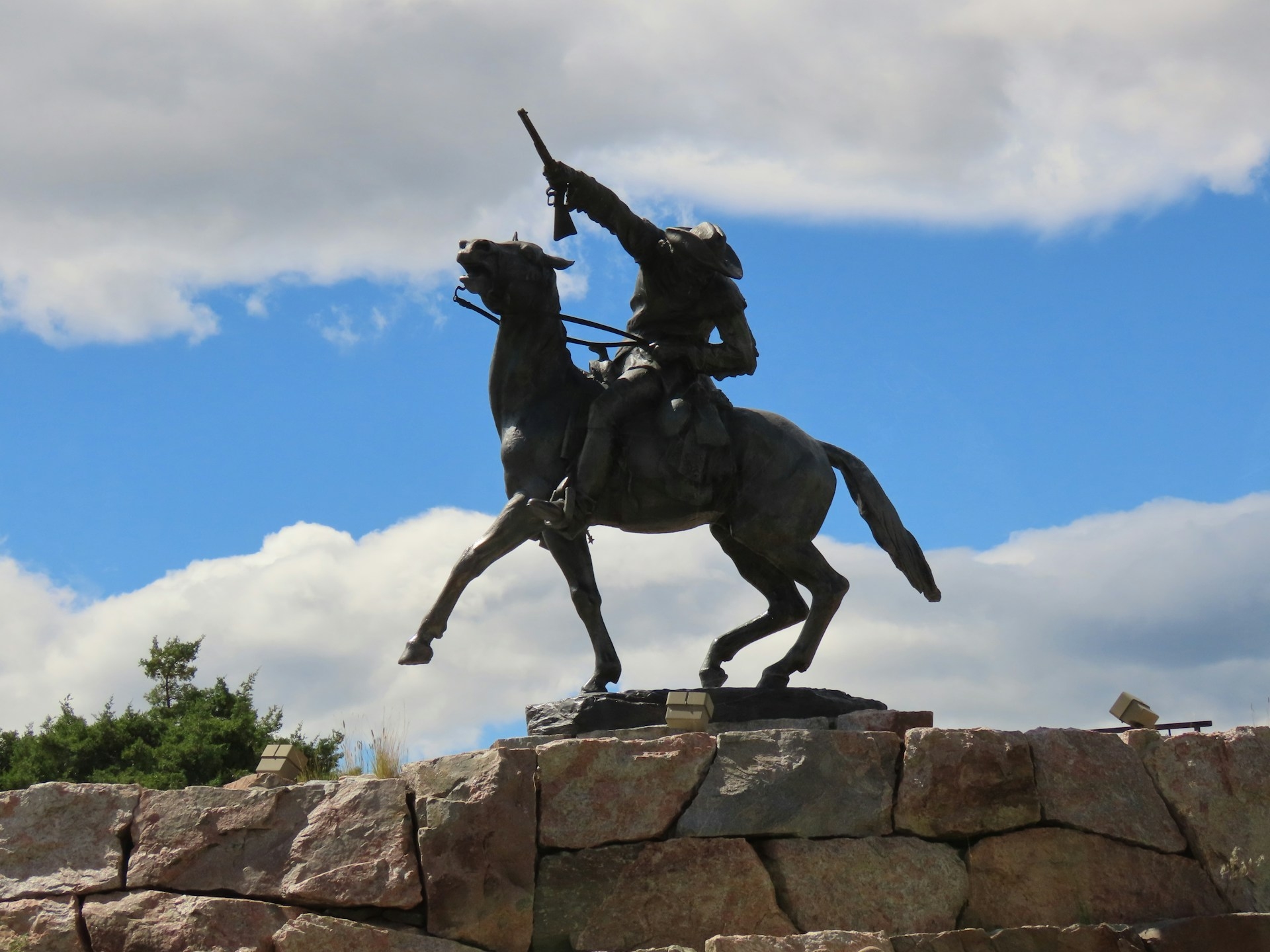 Buffalo Bill Museum with a statue of the Bill on the horse with a gun