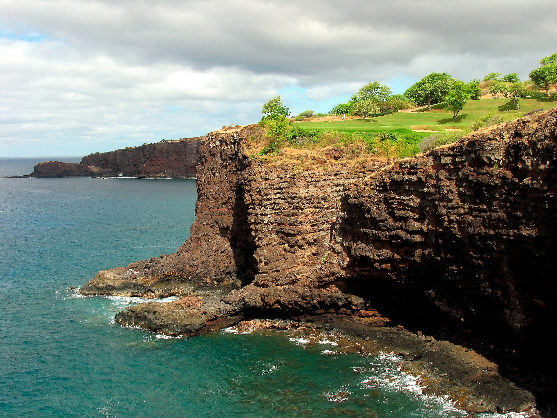Challenge at Manele showing the course and cliff