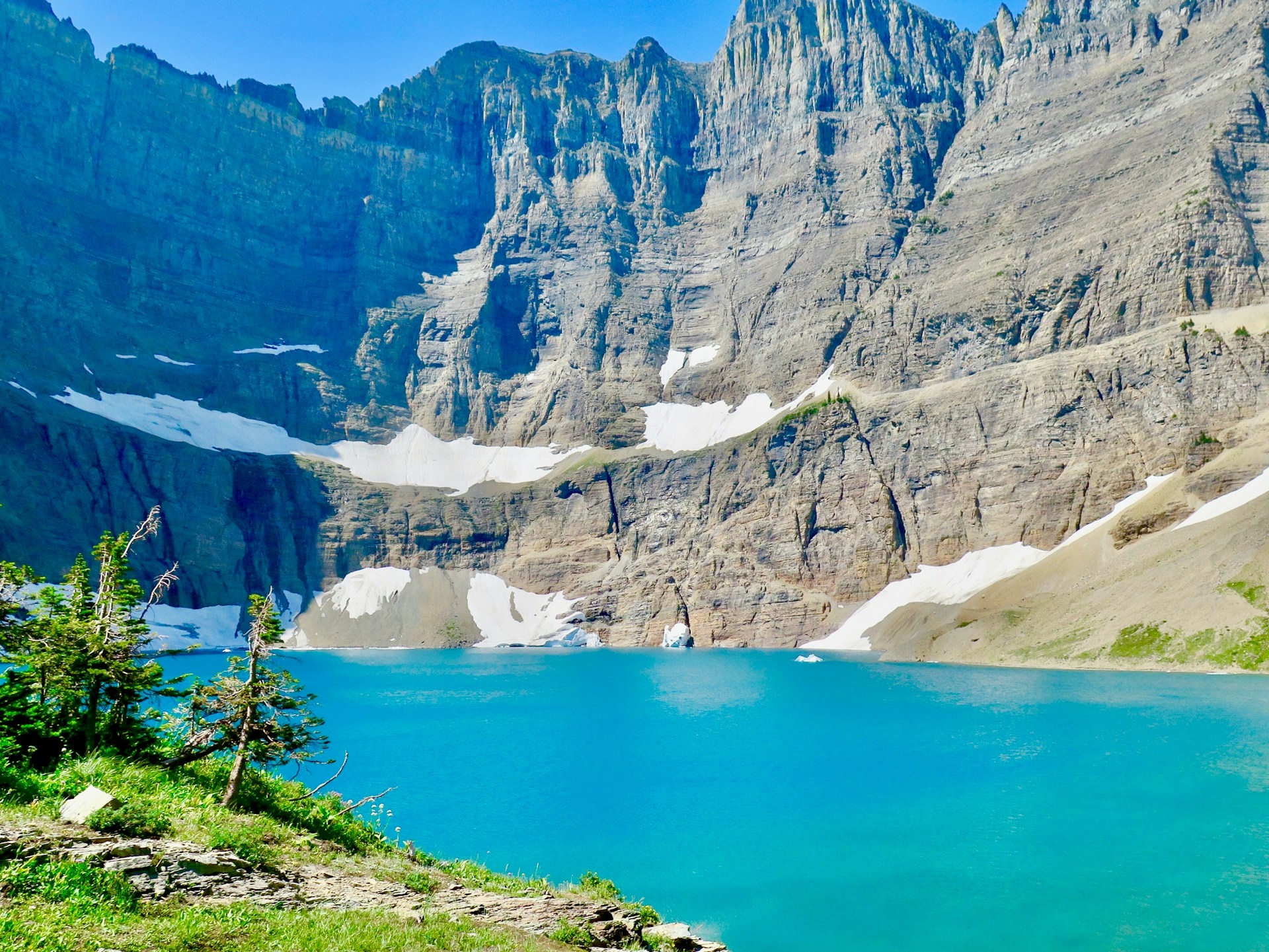 Ice Burg Lake Montana stunning light blue water with high mountains in the backdrop