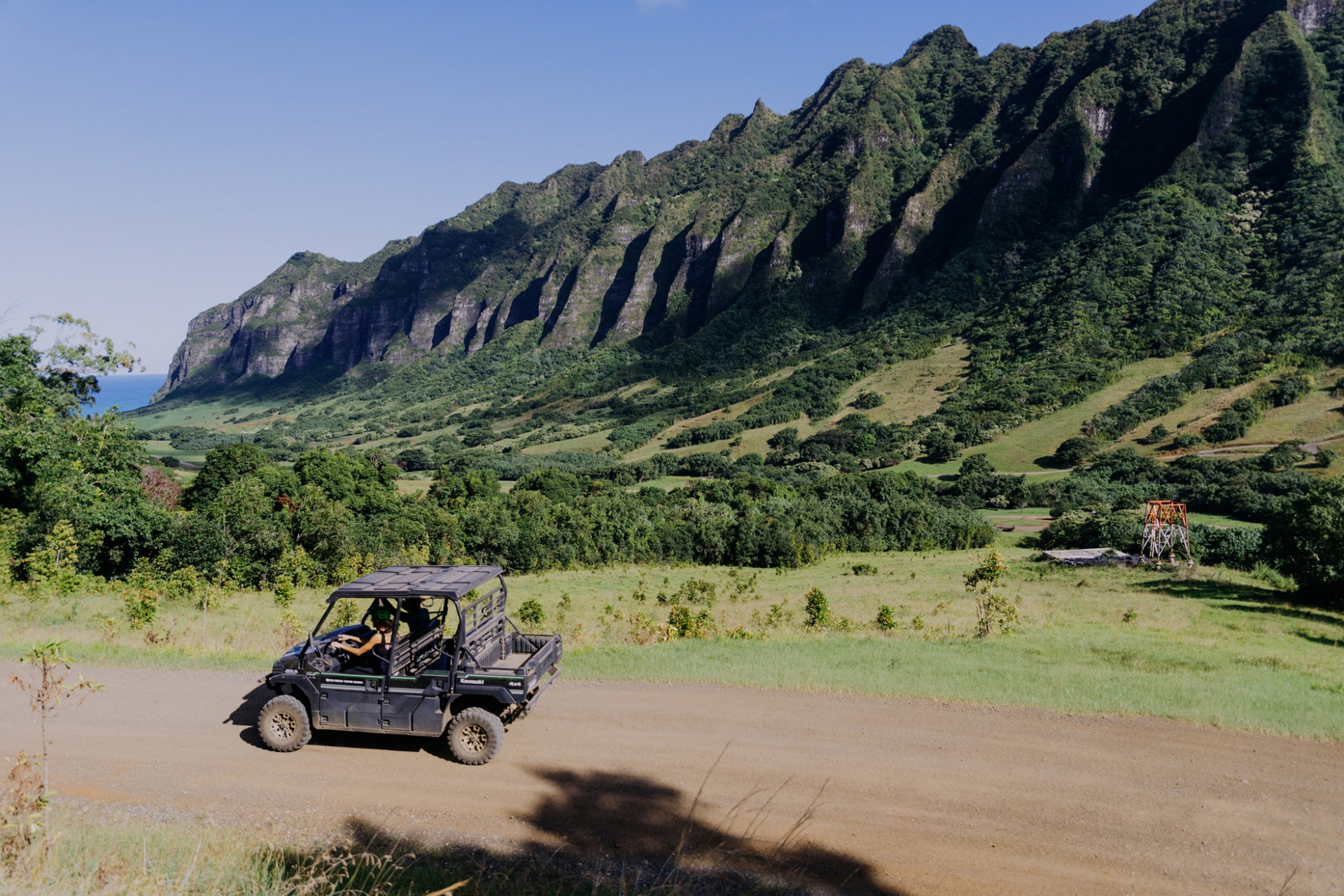 Kualoa Ranch riding along the dirt road in a buggy