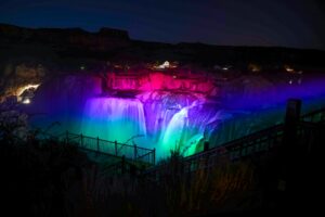 Shoshone Falls After Dark with pink & green & blue lights on the waterfalls
