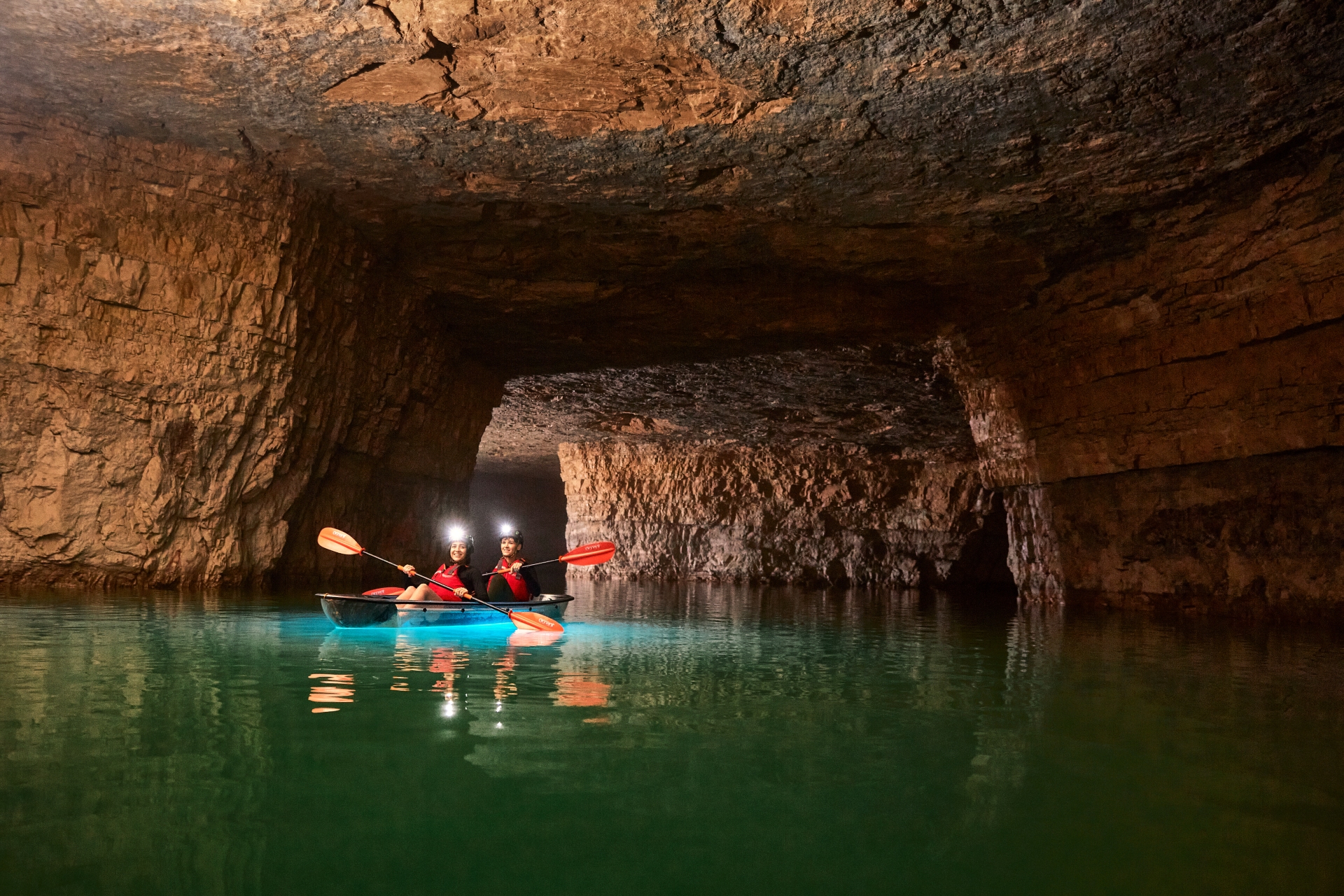 The-gorge-underground 2 people kayaking with lights on their heads