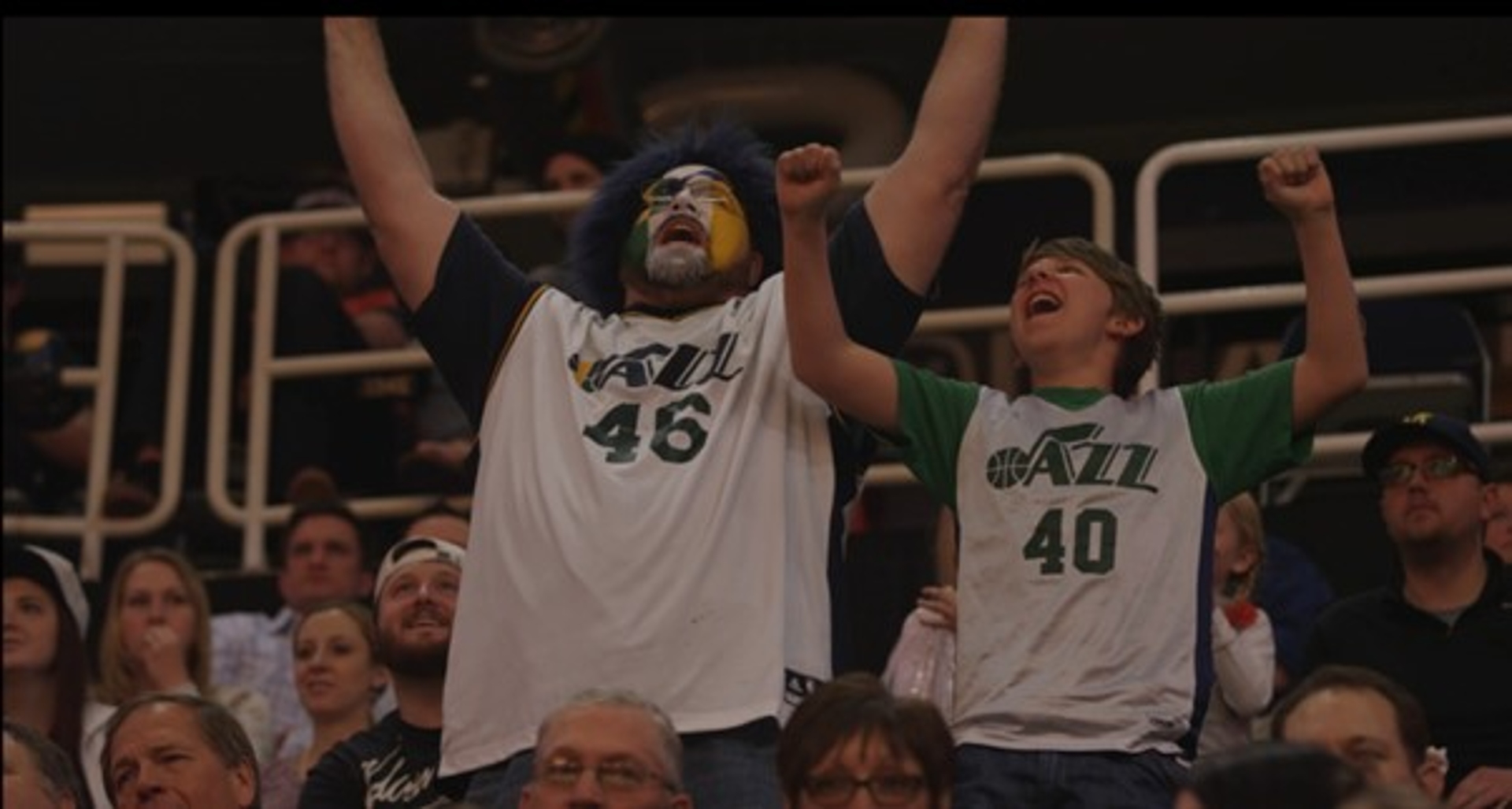 Father and son celebrating at the Utah Jazz game
