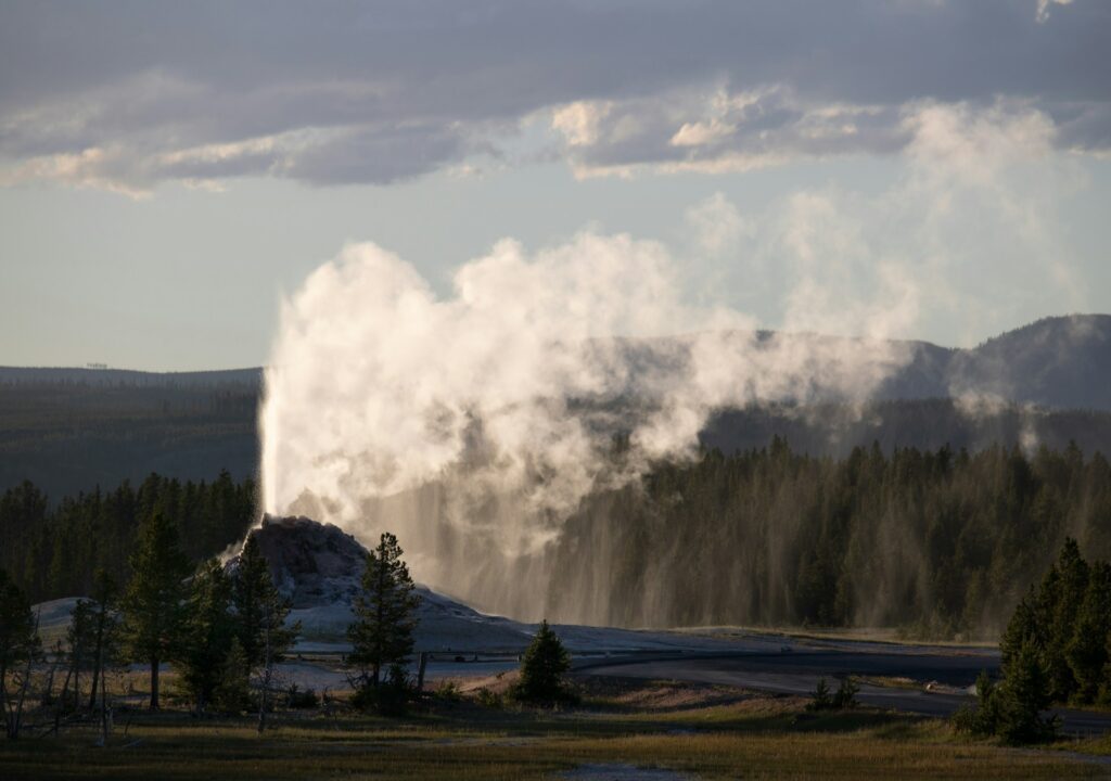 Yellowstone Erupting Geyser at sunset