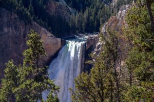 Yellowstone National Park Waterfall Wyoming showing the volume of water that goes over this waterfall and the shear drop below