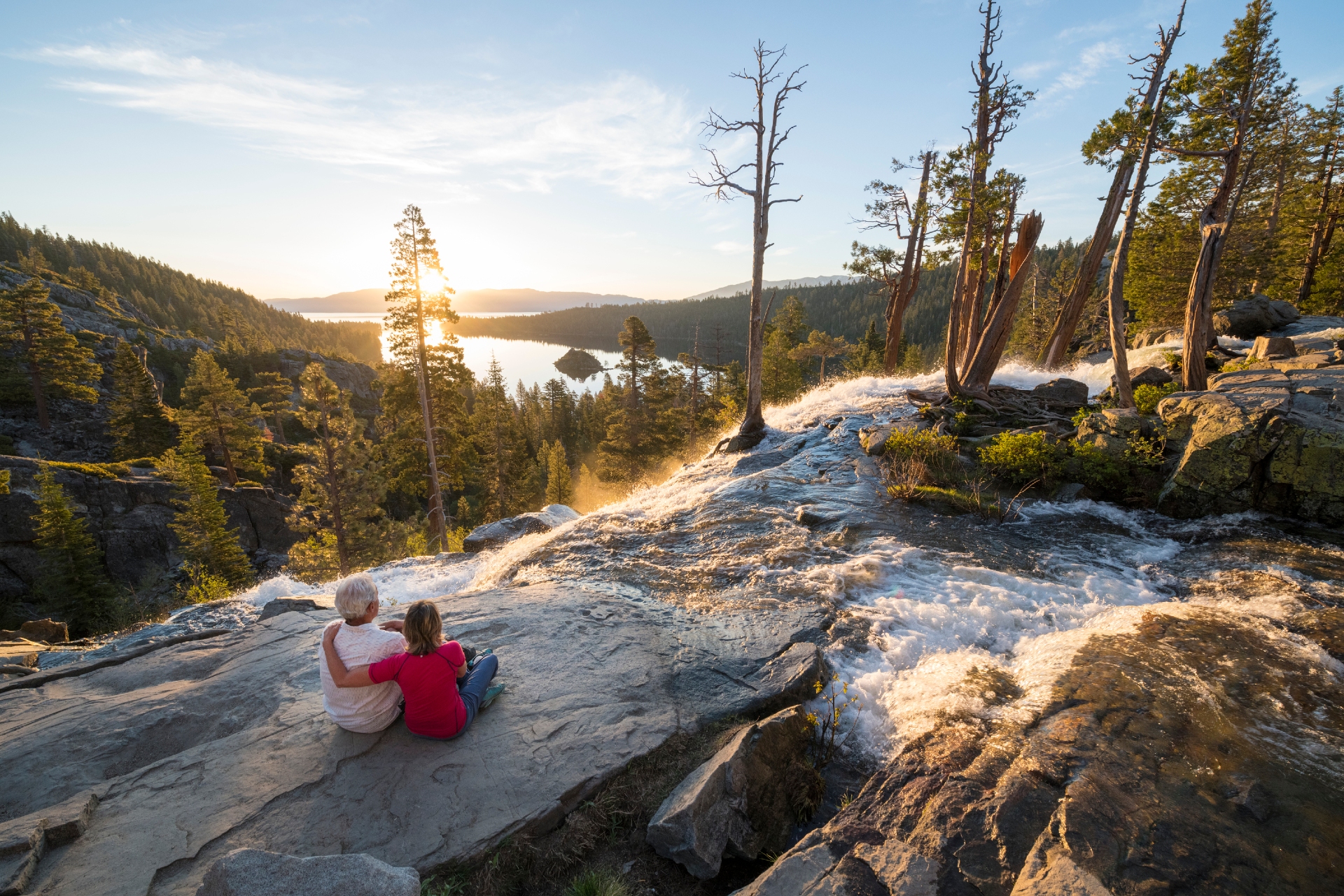 Couple sitting at the top of Eagle Falls at sunrise Credit Rachid Rahnoun and Lake Tahoe Visitors Authority