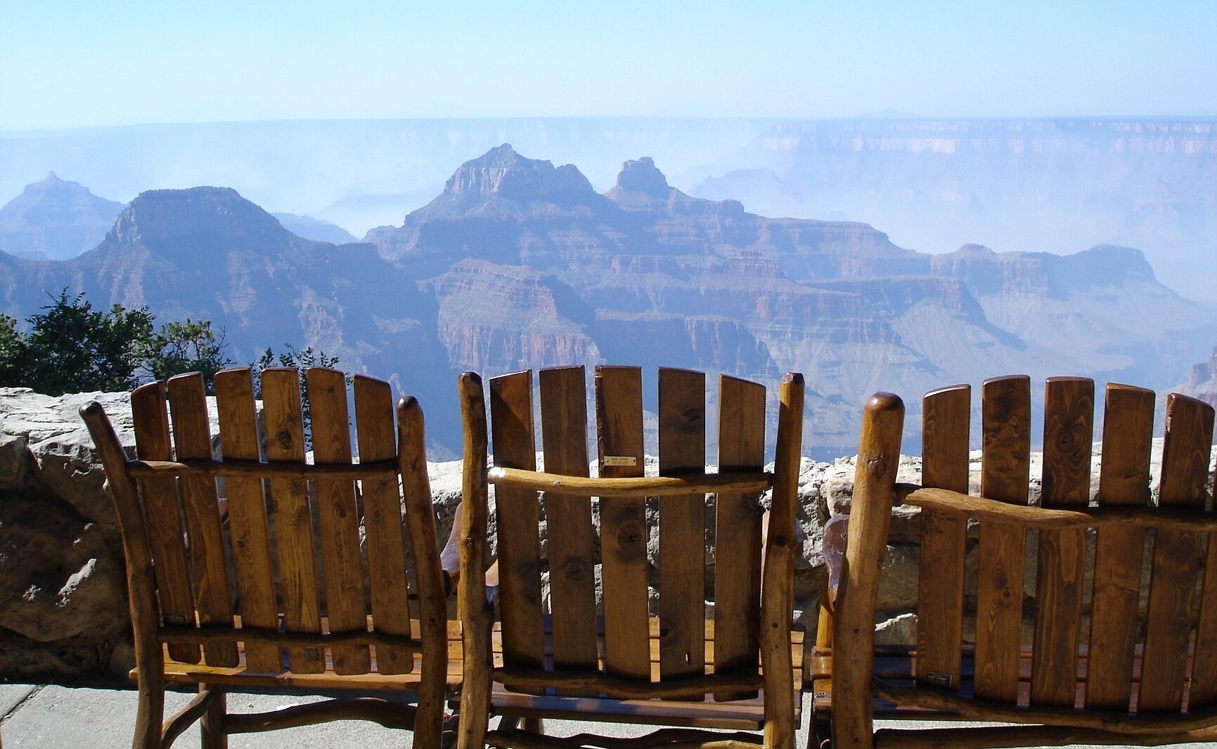 Grand Canyon man verse natural beauty of the canyon sit in the chairs to capture the stunning views
