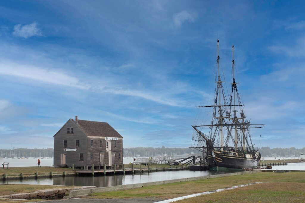 Massachuetts Salem Sail loft with the USS constitution style ship docked