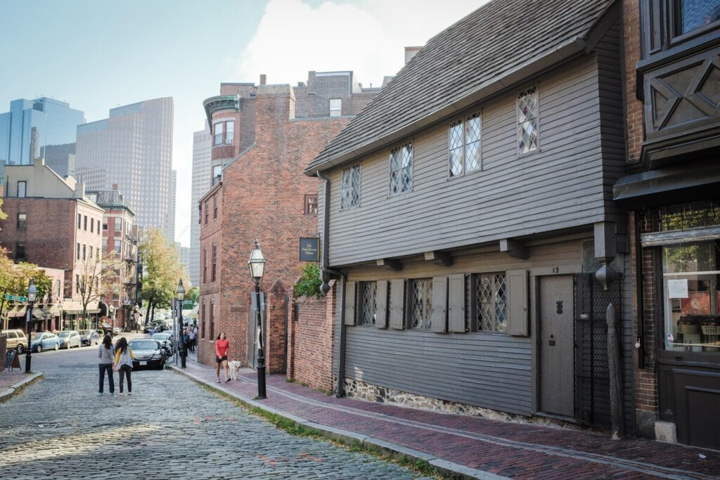 Paul Revere House showing the outside with the cobblestone road out the front