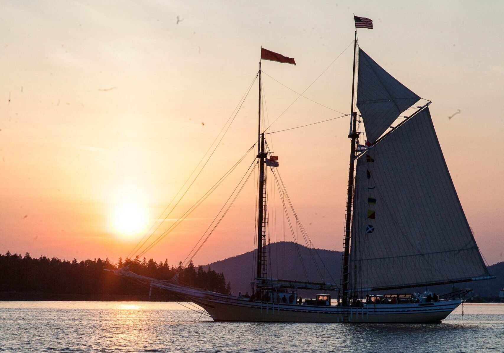Scooner Race in Maine an annual event with stunning ship from the past at sunset