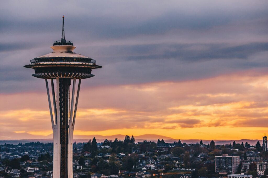 Space Needle with the island in the background at sunset in Seattle Washington State
