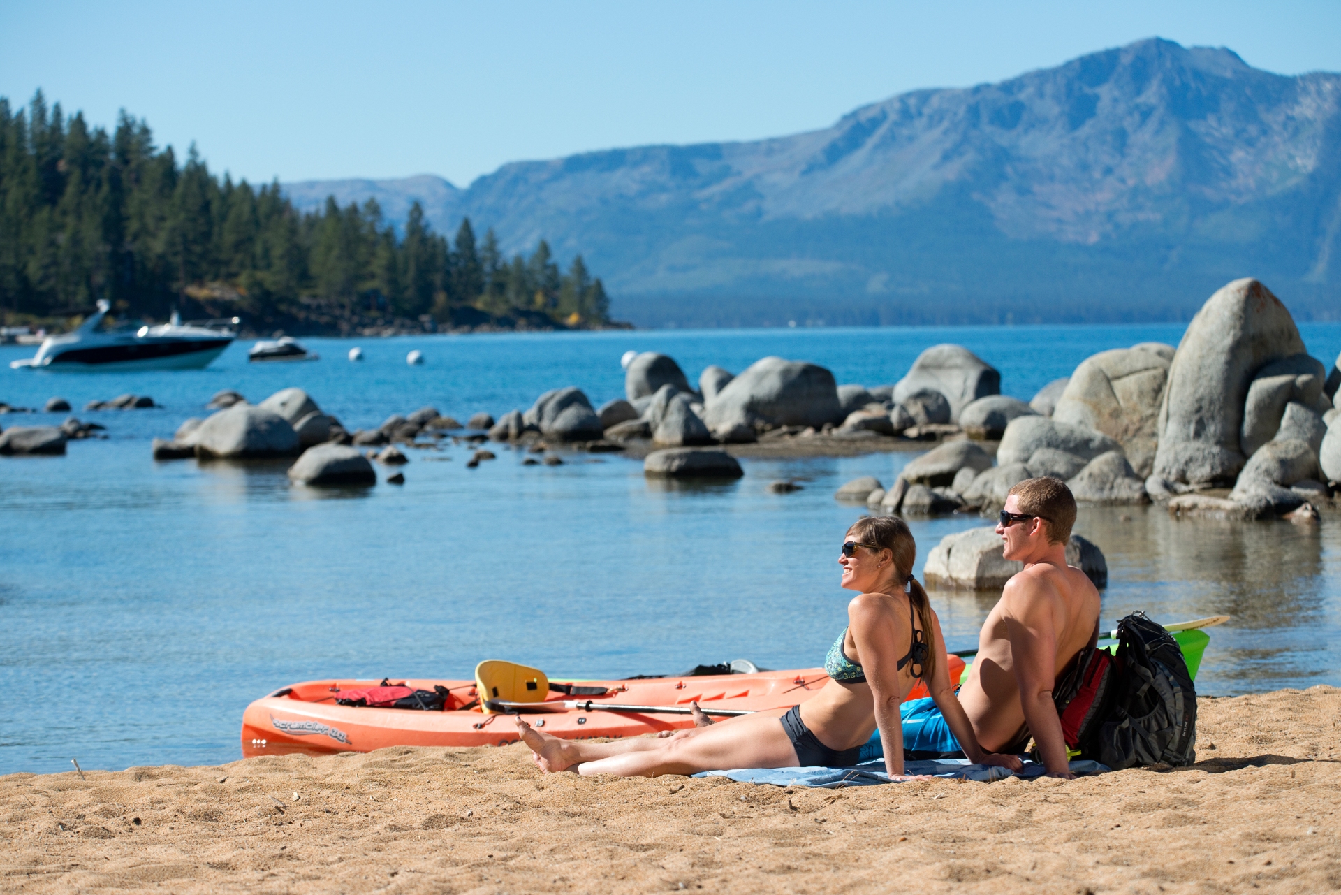 Two people sitting on the beach looking out to Lake Tahoe Credit Rachid Dahnoun and Lake Tahoe Visitors Authority 2