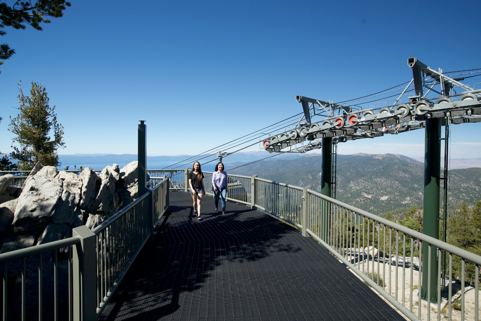 Two women walking on the observation deck at Heavenly Mountain Credit Lake Tahoe Visitors Authority