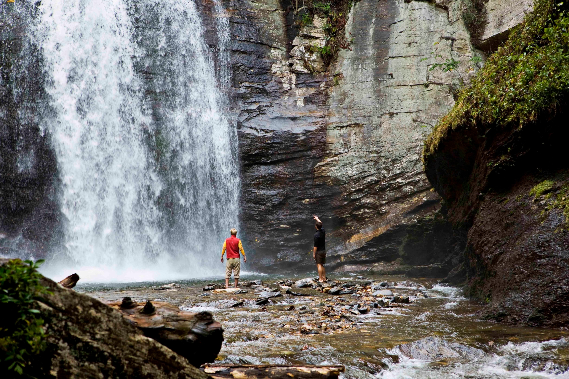 Hiking at Looking Glass Falls in Pisgah National Forest Credit Visit North Carolina