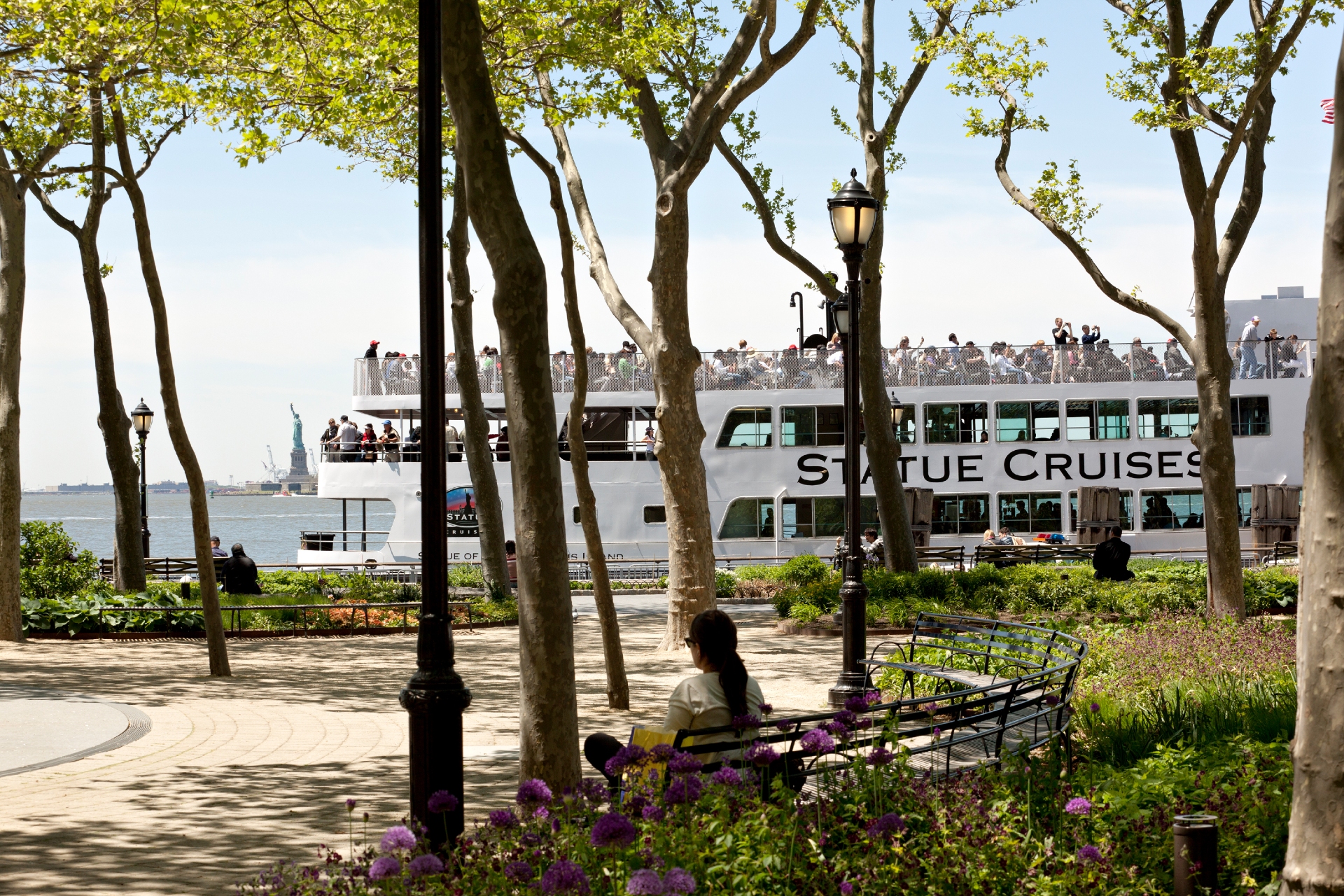 Statue Cruises at Battery Park showing the Statue of Liberty in the background
