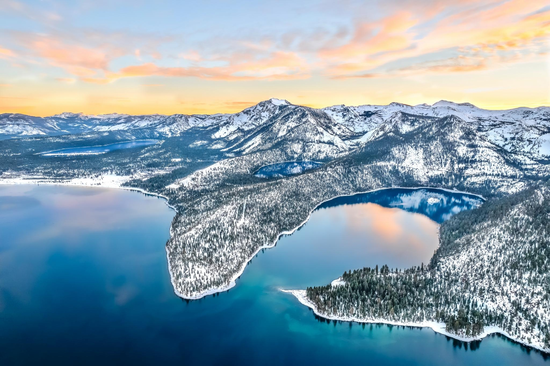 South Lake Tahoe Three Lakes aerial view of the lakes with stunning reflections of the snow capped mountains