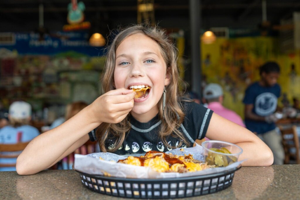 Kid enjoying Central BBQ Photo Credit Julian Harper Memphis Tourism