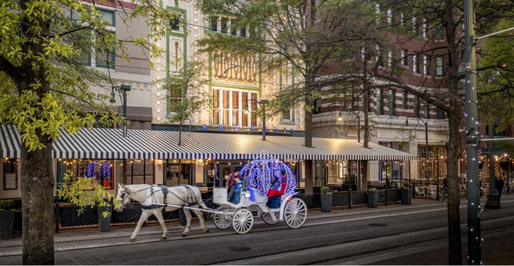 Main Street horse Carriage with purple lights along an historic street in Memphis