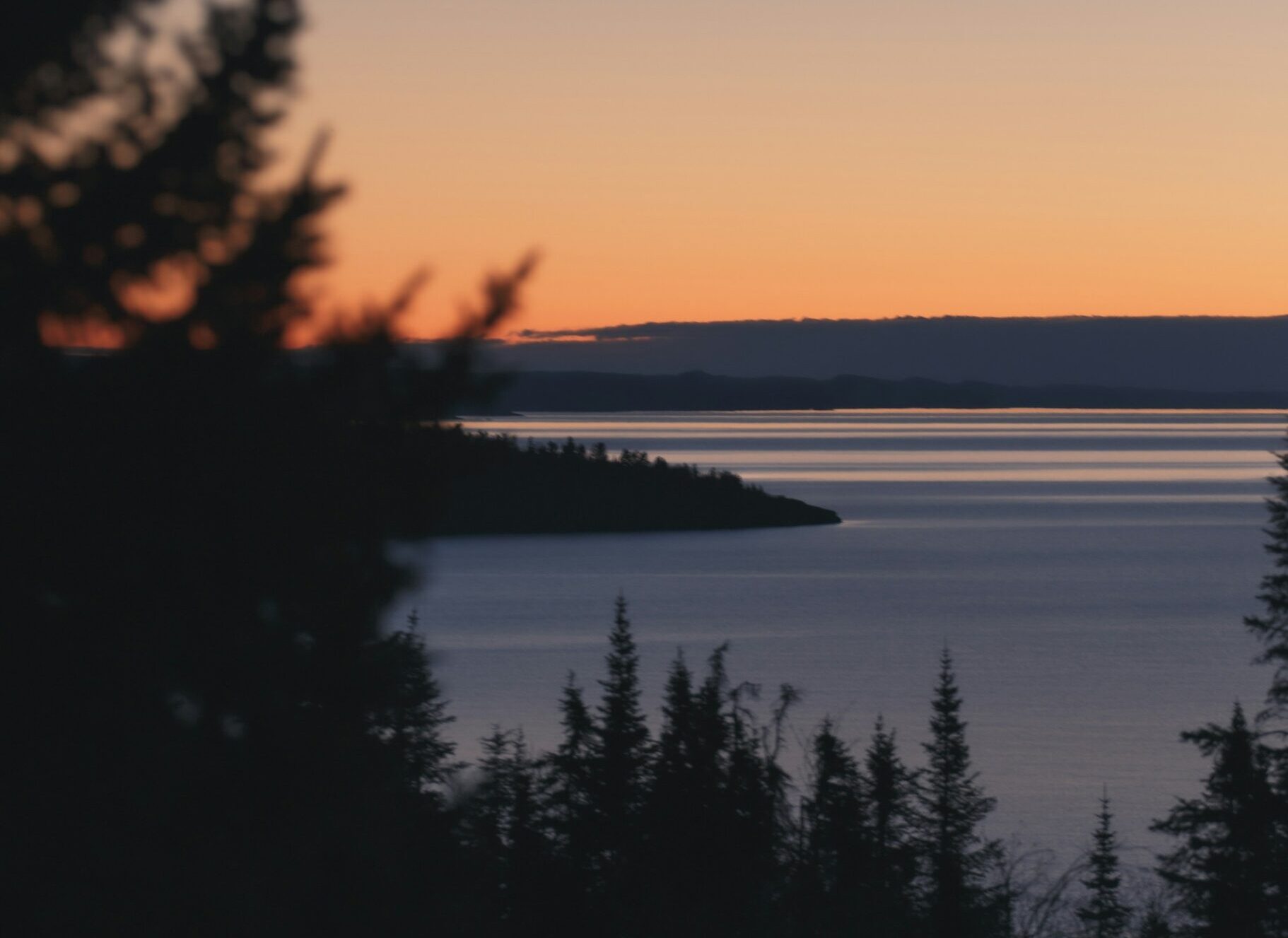 Lake Superior sunrise silhouette from Palisade Head near Silver Bay MN Image By aubree herrick unsplash 1 scaled e1742939564165