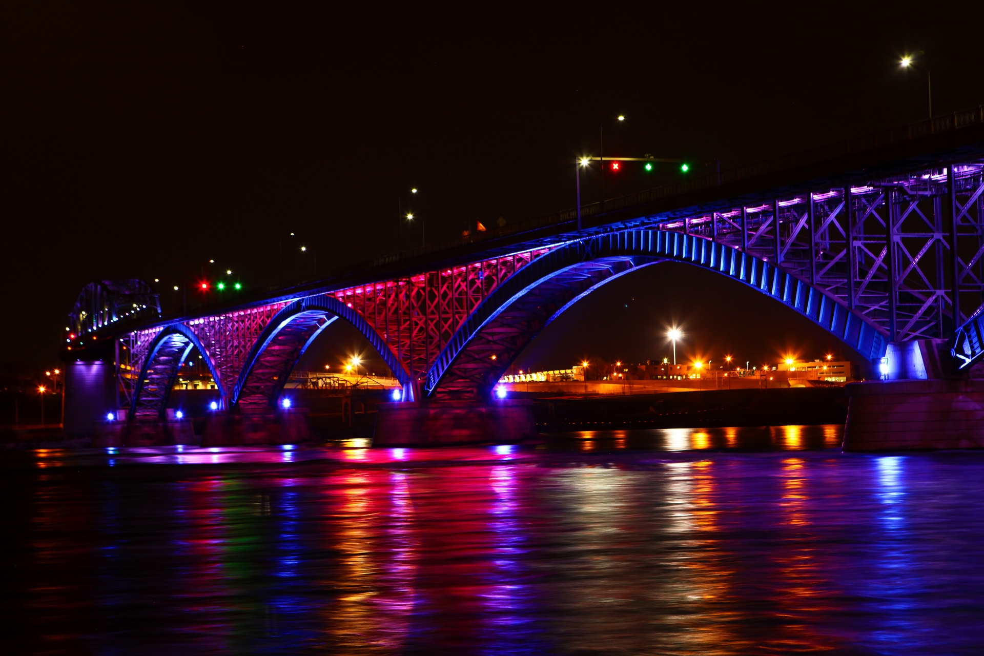 Buffalo Peace Bridge between Buffalo & Canada at night with all the stunning lights reflecting in the water