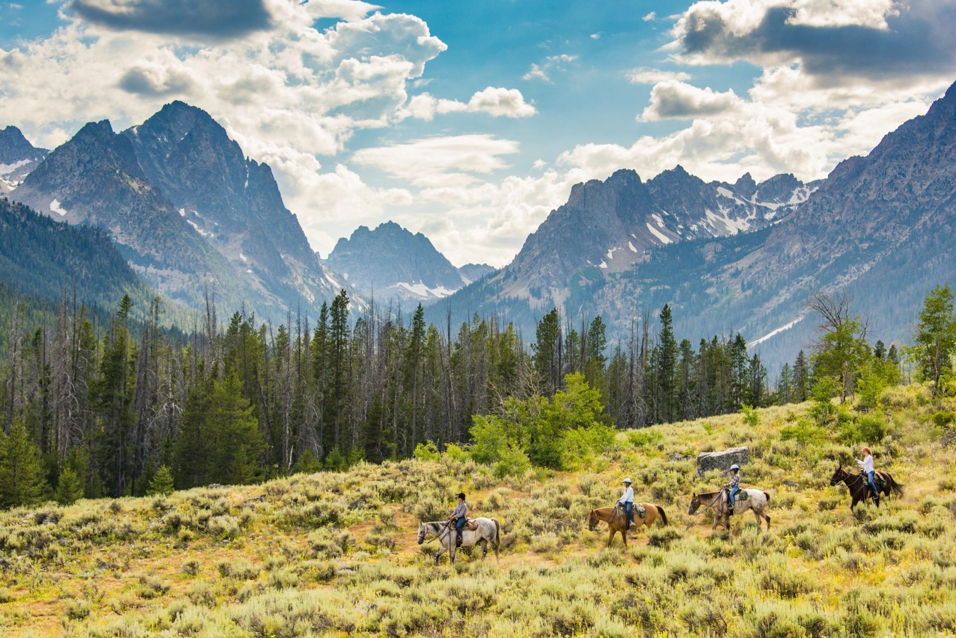 Horse riding Redfish Lake near Stanley Idaho Image by Visit Idaho
