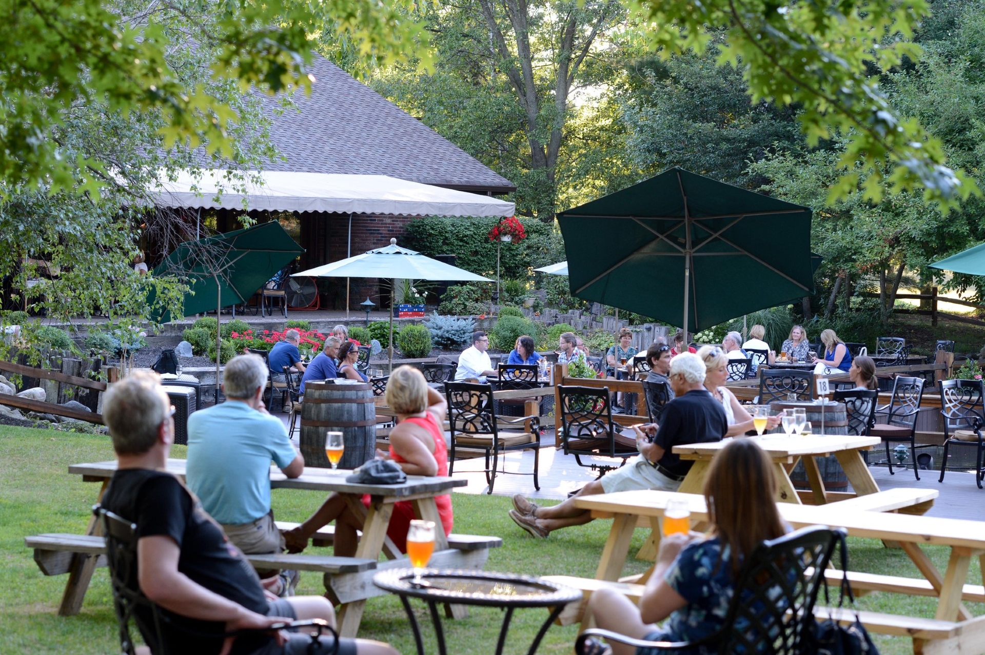 Hamburg Brewing Buffalo NYS showing patrons enjoying their beer tasting in the outdoor courtyard